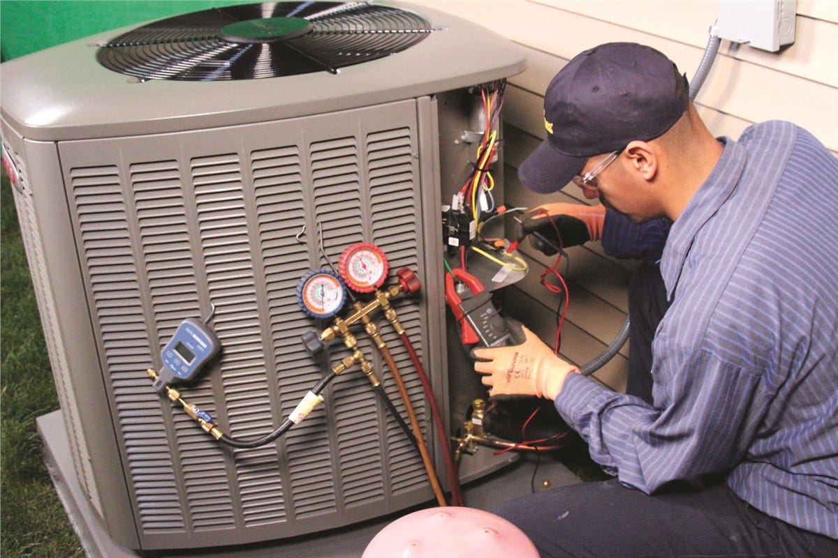 Champion Air Solutions technician performing AC maintenance